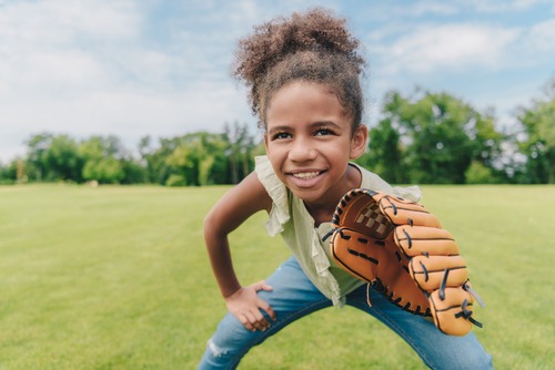 Little Girl Playing Baseball